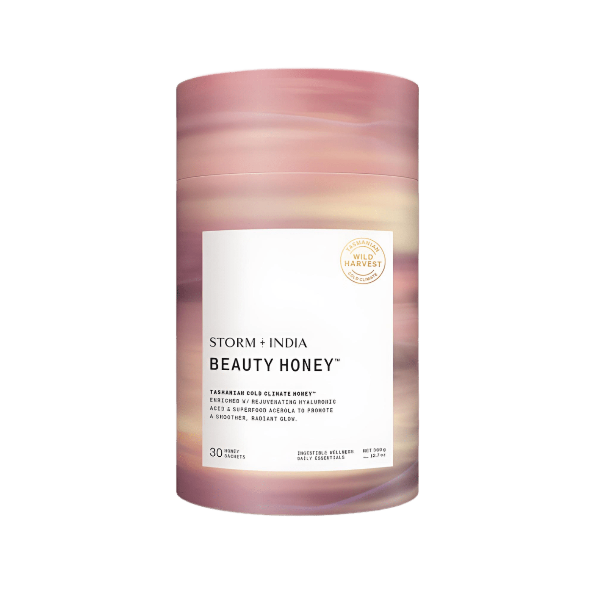 A cylindrical container with pink and beige swirls, labeled JING Organics Storm + India Beauty Honey, sits upright. The label notes Tasmanian cold climate honey, contains 30 sachets, and displays a gold Wild Harvest stamp.